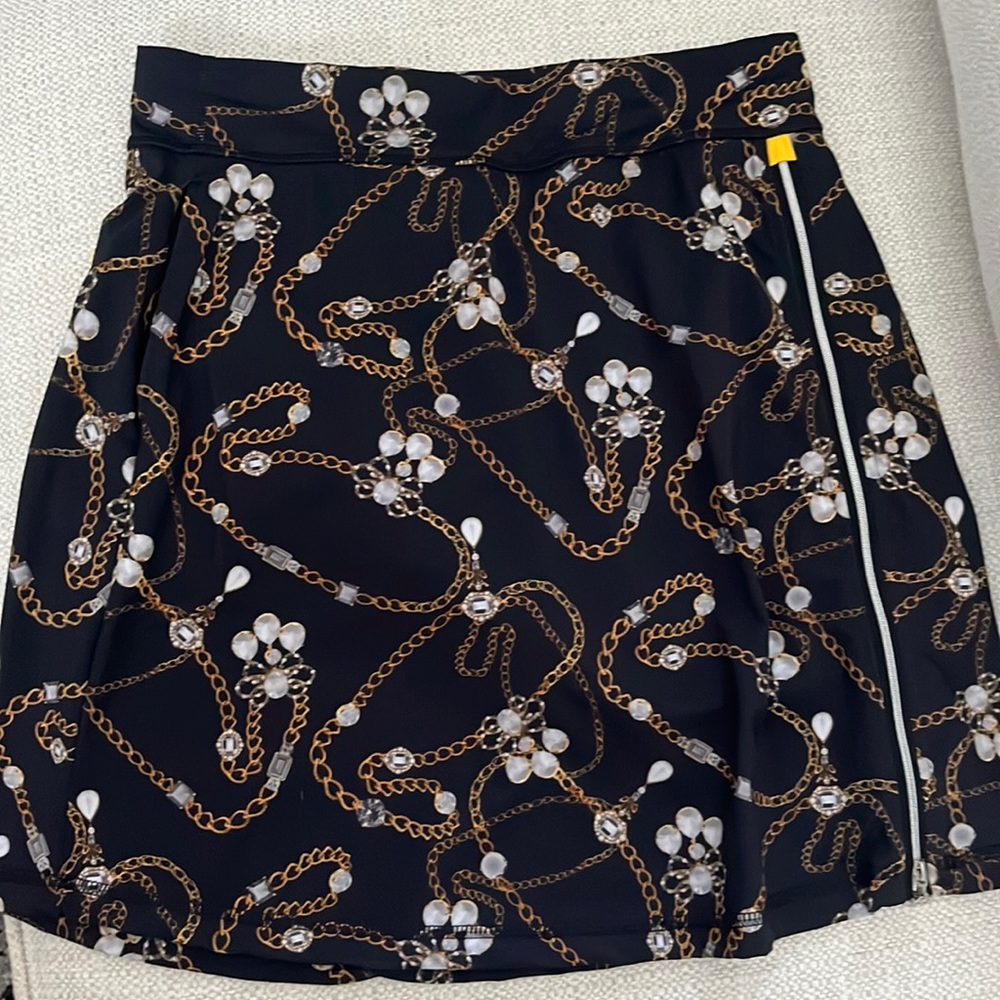 Sofibella golf skort.   Diamonds and chains pattern